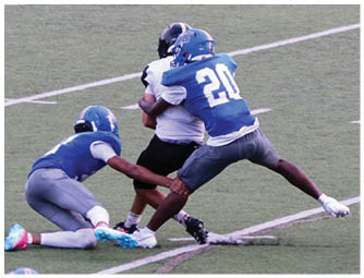A group of football players on a field. Description generated by AI