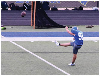 A group of football players on a field. Description generated by AI