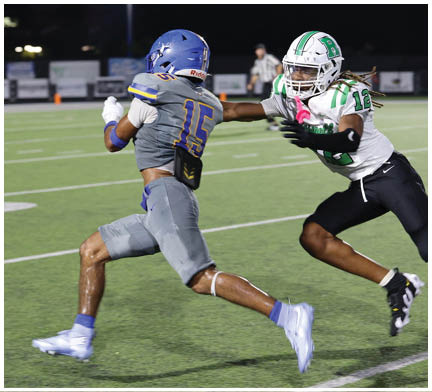 A football player running on the field. Description generated by AI