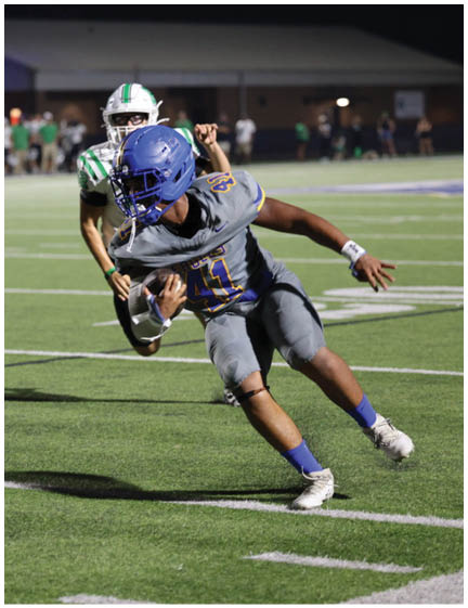 A football player wearing a blue jersey with the number 58 on it. Description generated by AI
