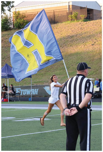 A football game is being played on a field. Description generated by AI