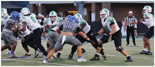 A football player is sliding on the ground. Description generated by AI