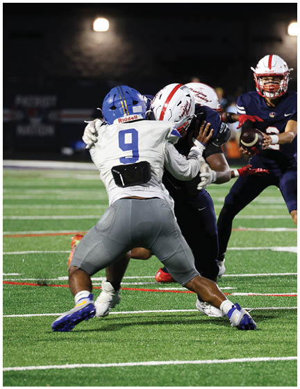 A football player wearing a blue jersey with the number 58 on it. Description generated by AI