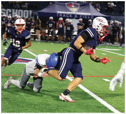 A football player running on the field. Description generated by AI
