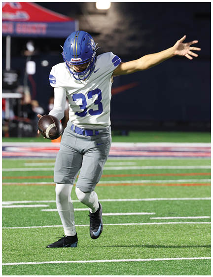 A football player wearing a blue jersey with the number 58 on it. Description generated by AI