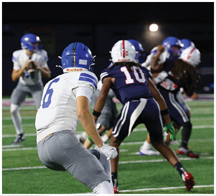 A football player running on the field. Description generated by AI