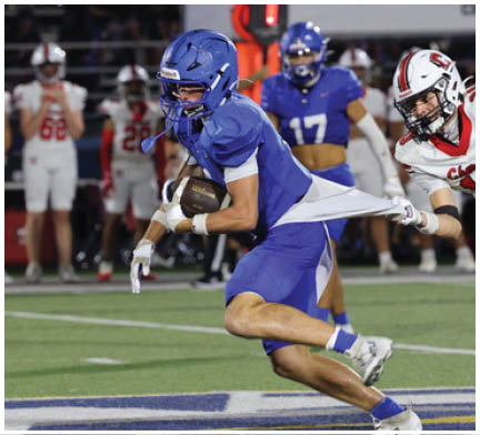 A football player running on the field. Description generated by AI