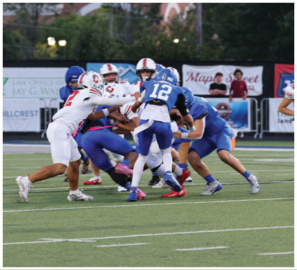 A football player running on the field. Description generated by AI