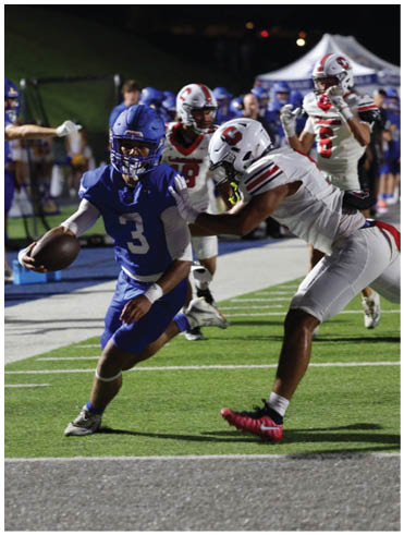 A football player is sliding on the ground. Description generated by AI
