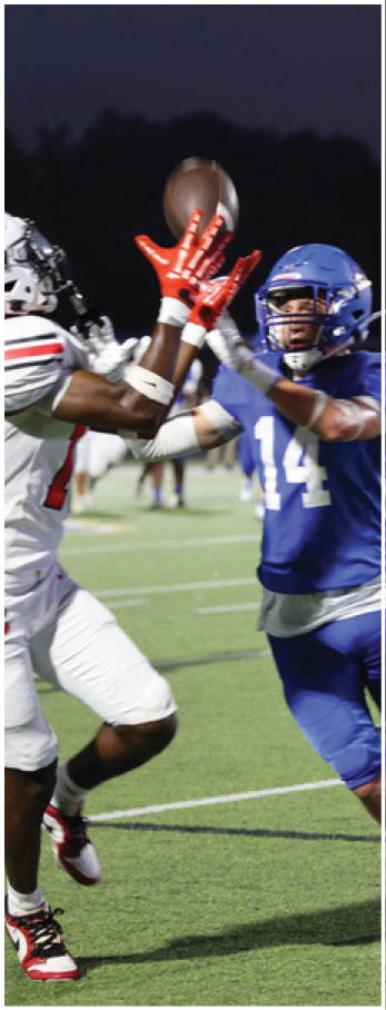 A football player running on the field. Description generated by AI
