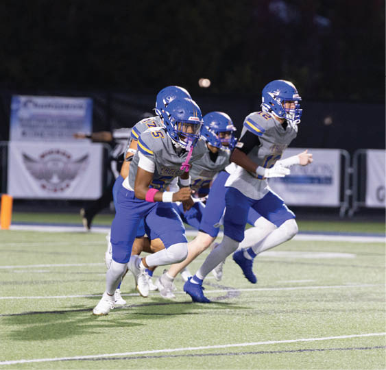 A group of football players celebrating a victory. AI generated content