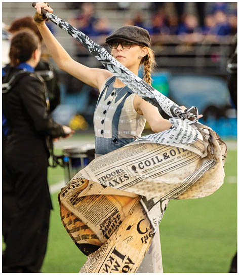 A football player catching a ball. Description generated by AI