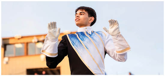 A football player wearing a blue and white uniform. Description generated by AI