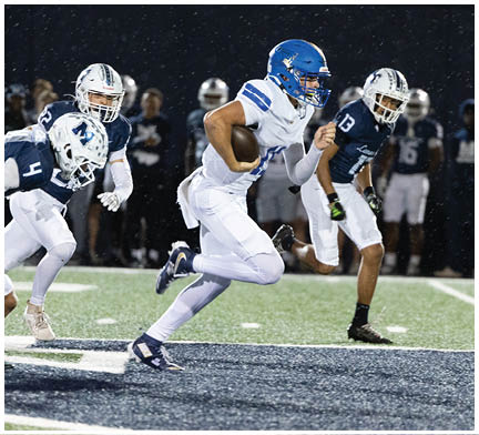 A football player running on the field. Description generated by AI
