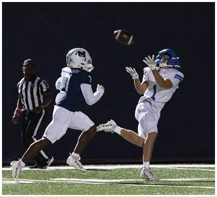 A football player running on the field. Description generated by AI