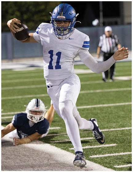 A football player wearing a blue jersey with the number 58 on it. Description generated by AI