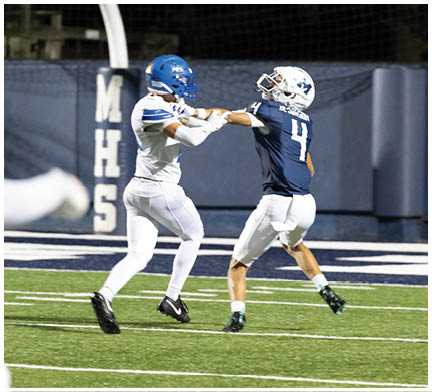 A football player running on the field. Description generated by AI