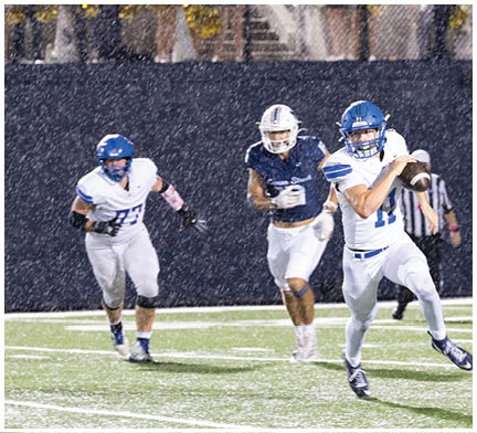 A football player running on the field. Description generated by AI