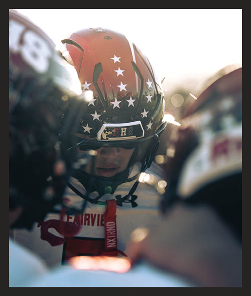 A football player in a white uniform is running with a football in his hand. AI generated content