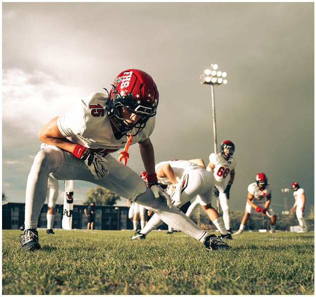 A football player wearing a blue jersey with the number 58 on it. Description generated by AI
