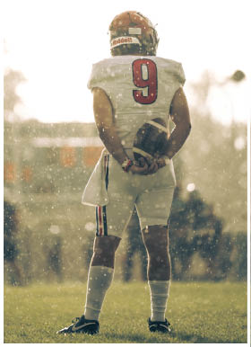 A football player wearing a blue jersey with the number 58 on it. Description generated by AI