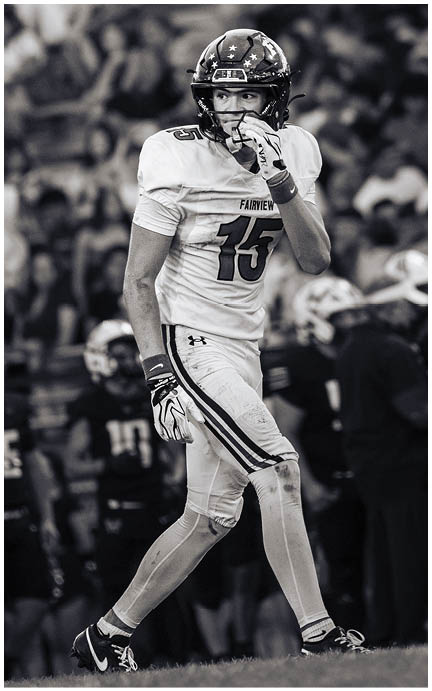 A football player wearing a blue jersey with the number 58 on it. Description generated by AI