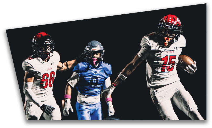 People wearing black American Canyon football uniforms and helmets are standing on a football field at night. Description generated by AI