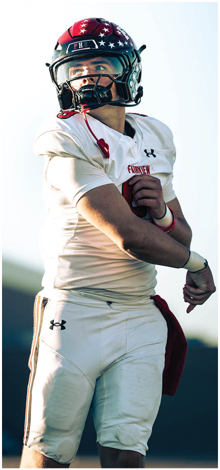 A football player wearing a blue and white uniform. Description generated by AI