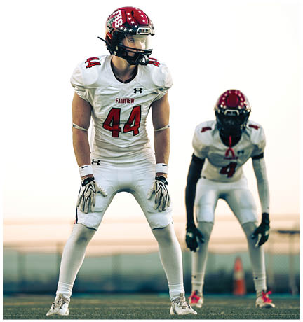 A football player running on the field. Description generated by AI