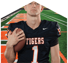 A young man wearing a white jersey with the number 10 on it. Description generated by AI