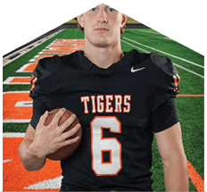 A young man wearing a white jersey with the number 10 on it. Description generated by AI