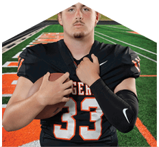 A young man wearing a white jersey with the number 10 on it. Description generated by AI
