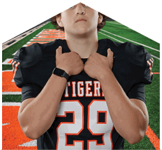 A young man wearing a white jersey with the number 10 on it. Description generated by AI