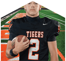 A young man wearing a white jersey with the number 10 on it. Description generated by AI