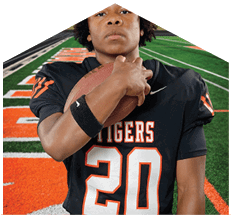 A young man wearing a white jersey with the number 10 on it. Description generated by AI
