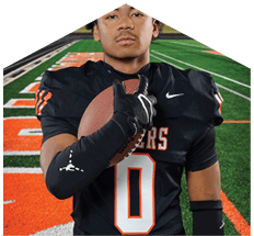 A young man wearing a white jersey with the number 10 on it. Description generated by AI