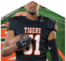 A young man wearing a white jersey with the number 10 on it. Description generated by AI