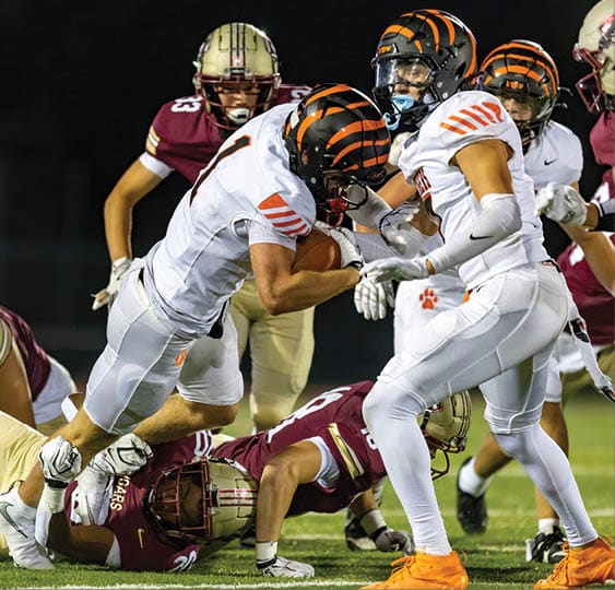 A group of football players celebrating a victory. AI generated content