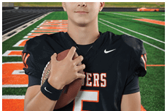 A young man wearing a white jersey with the number 10 on it. Description generated by AI