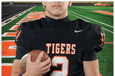 A young man wearing a white jersey with the number 10 on it. Description generated by AI