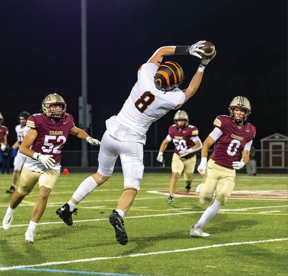 A group of football players celebrating a victory. AI generated content