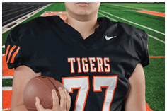 A young man wearing a white jersey with the number 10 on it. Description generated by AI
