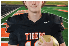A young man wearing a white jersey with the number 10 on it. Description generated by AI