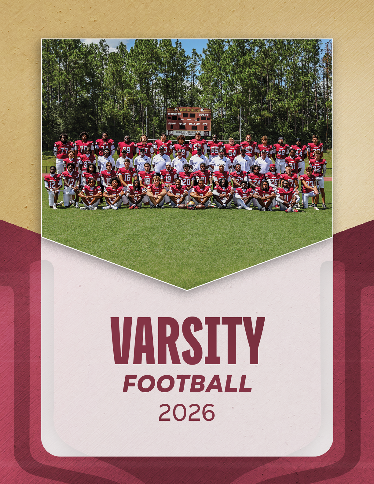 A large group of people in red and white football uniforms pose together on a grassy field with trees and a scoreboard in the background above the text reading varsity football 2026. Description generated by AI