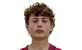 A person with curly hair is standing wearing a maroon football jersey with the number 33 and the word Seminoles on the front. Description generated by AI