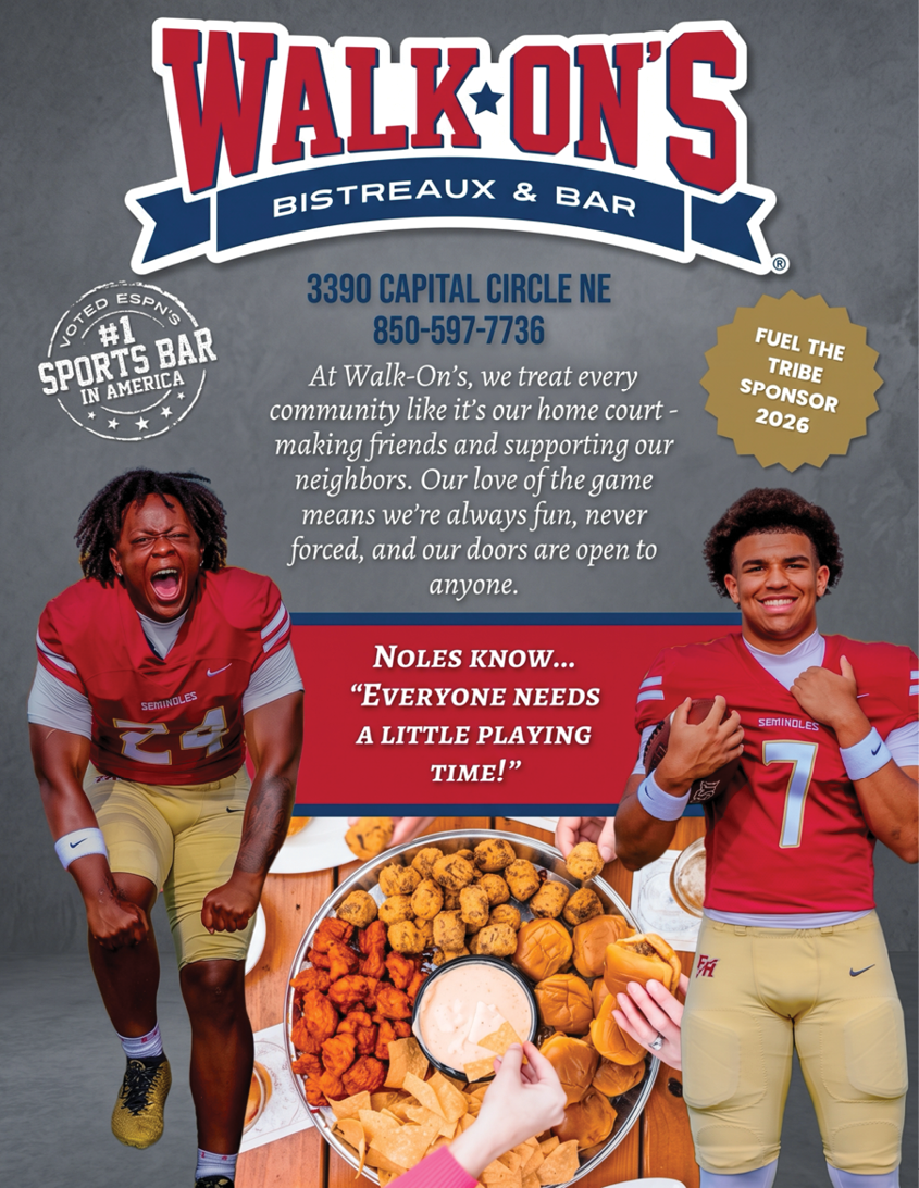 Two people in football uniforms enthusiastically pose with a large plate of assorted fried snacks in front of a Walk-On's Bistreaux & Bar advertisement promoting community support and a sports bar. Description generated by AI