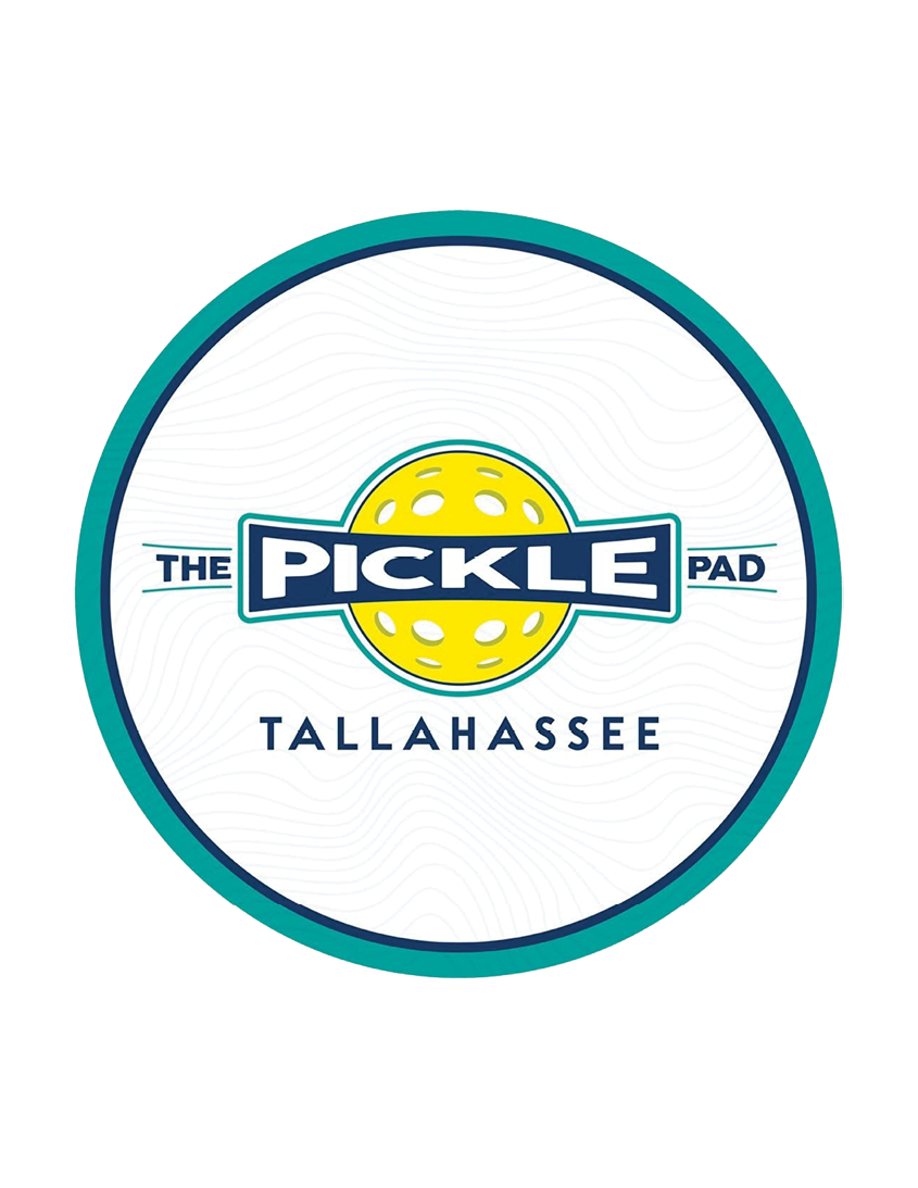A circular logo with a teal and dark blue border featuring a yellow pickleball and the text “The Pickle Pad Tallahassee" in bold letters. Description generated by AI