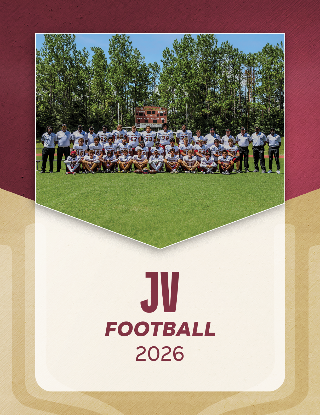 A group of people in football uniforms and coaches standing and kneeling on a grassy field with trees and a scoreboard in the background, labeled JV Football 2026. Description generated by AI