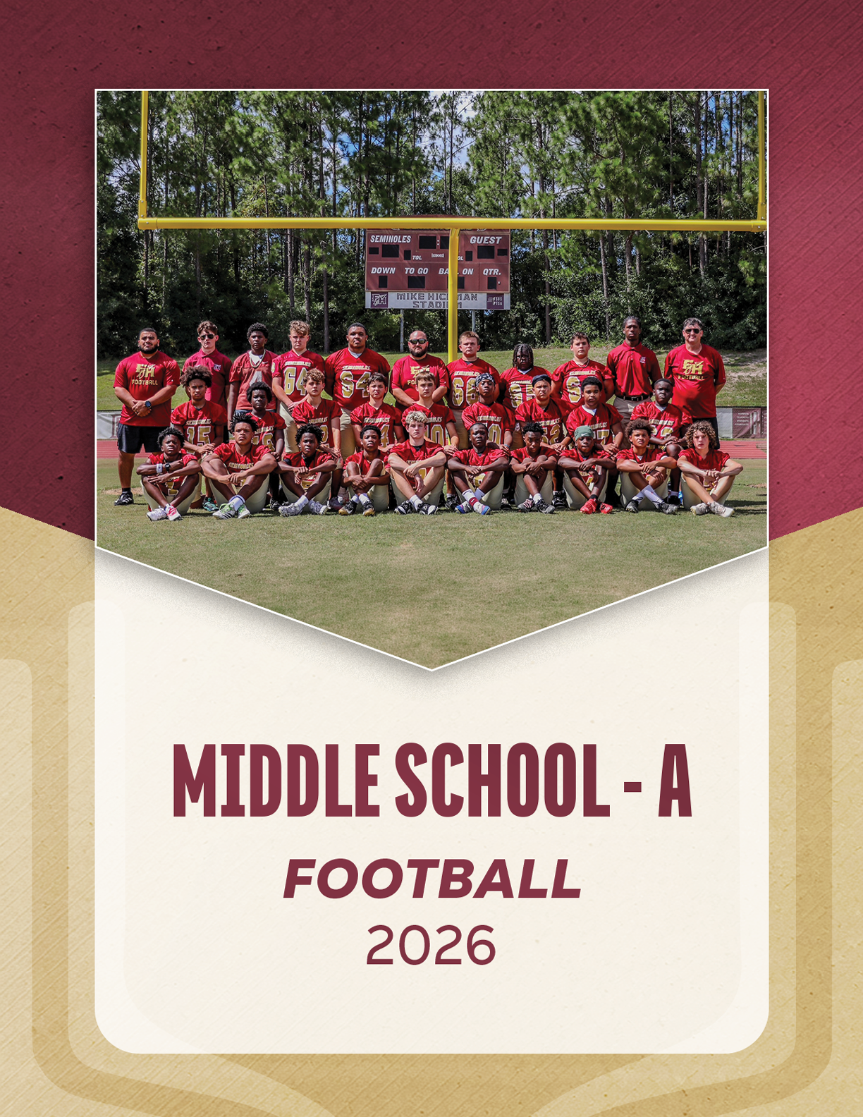 A group of people in football uniforms and coaches standing and kneeling on a grassy field with trees and a scoreboard in the background, labeled JV Football 2026. Description generated by AI