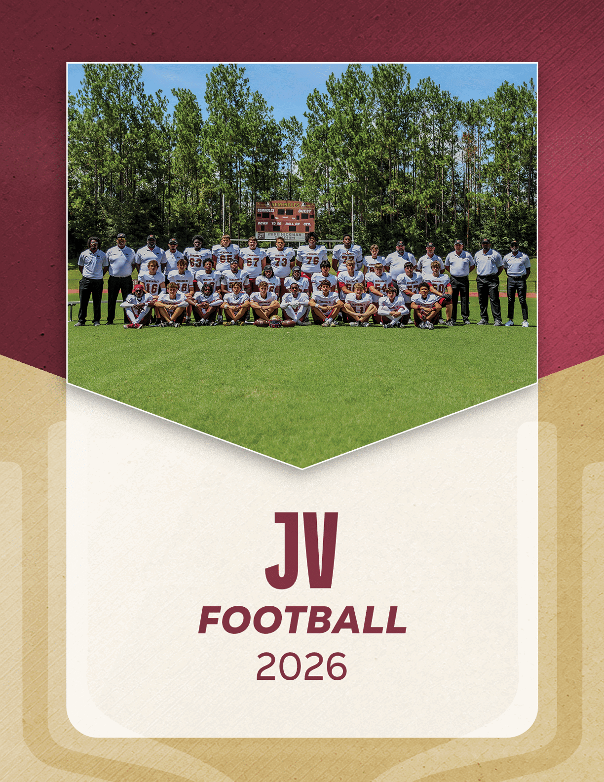 A group of people in football uniforms and coaches standing and kneeling on a grassy field with trees and a scoreboard in the background, labeled JV Football 2026. Description generated by AI